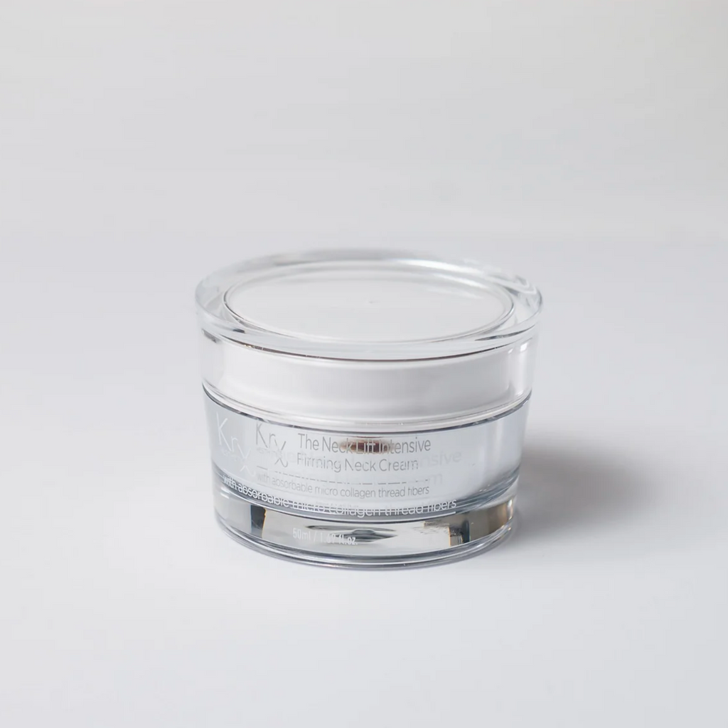 Clear glass jar with white cream on a light gray background