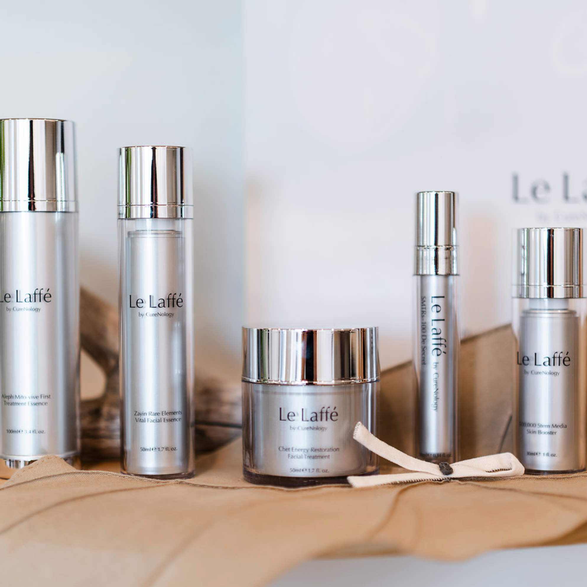 Collection of Le Laffe skincare products on a light gray background